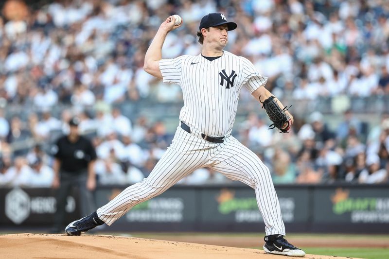 Jun 19, 2024; Bronx, New York, USA;  New York Yankees starting pitcher Gerrit Cole (45) pitches in the first inning against the Baltimore Orioles at Yankee Stadium. Mandatory Credit: Wendell Cruz-USA TODAY Sports
