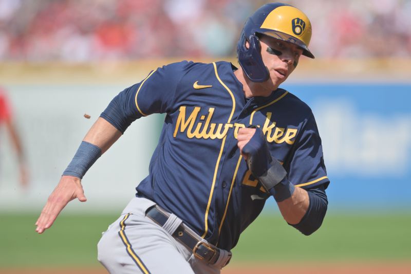 Jun 24, 2023; Cleveland, Ohio, USA; Milwaukee Brewers left fielder Christian Yelich (22) rounds third base en route to scoring during the first inning against the Cleveland Guardians at Progressive Field. Mandatory Credit: Ken Blaze-USA TODAY Sports