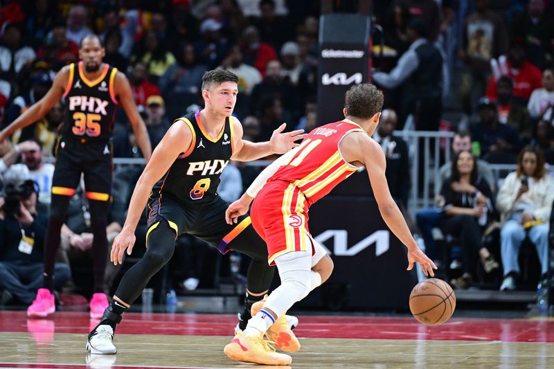 ATLANTA, GA - FEBRUARY 2: Grayson Allen #8 of the Phoenix Suns plays defense during the game against the Atlanta Hawks on February 2, 2024 at State Farm Arena in Atlanta, Georgia.  NOTE TO USER: User expressly acknowledges and agrees that, by downloading and/or using this Photograph, user is consenting to the terms and conditions of the Getty Images License Agreement. Mandatory Copyright Notice: Copyright 2024 NBAE (Photo by Adam Hagy/NBAE via Getty Images)