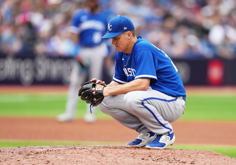 Sep 9, 2023; Toronto, Ontario, CAN; Kansas City Royals  pitcher Zack Greinke (23) looks at his glove against the Toronto Blue Jays during the fifth inning at Rogers Centre. Mandatory Credit: Nick Turchiaro-USA TODAY Sports