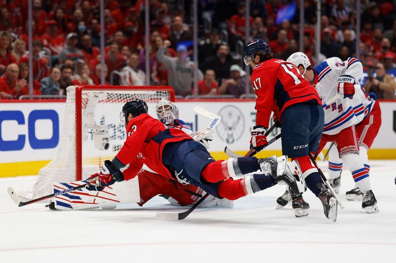 Apr 28, 2024; Washington, District of Columbia, USA; New York Rangers goaltender Igor Shesterkin (31) makes a save on Washington Capitals right wing Tom Wilson (43) in the first period in game four of the first round of the 2024 Stanley Cup Playoffs at Capital One Arena. Mandatory Credit: Geoff Burke-USA TODAY Sports