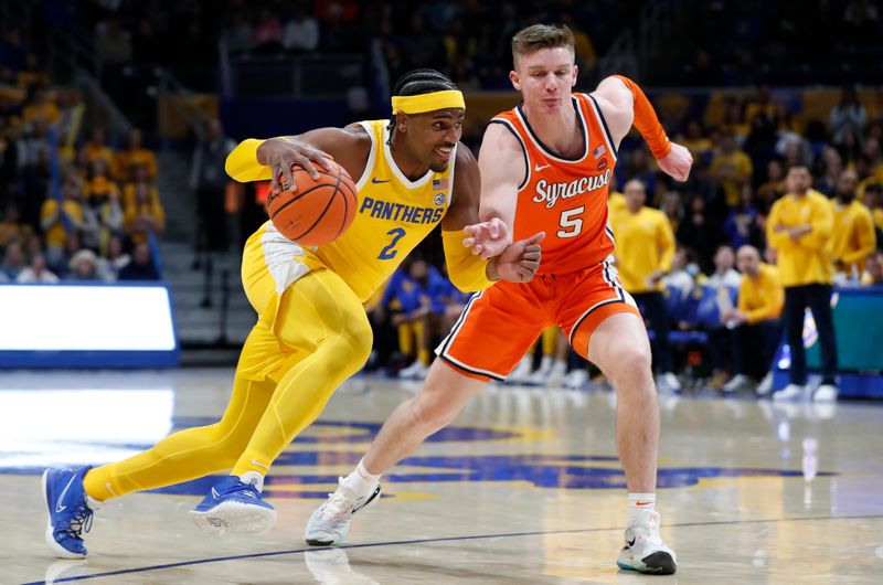 Jan 16, 2024; Pittsburgh, Pennsylvania, USA; Pittsburgh Panthers forward Blake Hinson (2) goes to the basket as Syracuse Orange guard Justin Taylor (5) defends during the first half at the Petersen Events Center. Mandatory Credit: Charles LeClaire-USA TODAY Sports