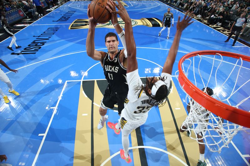 MILWAUKEE, WI - NOVEMBER 22:  Brook Lopez #11 of the Milwaukee Bucks drives to the basket during the game against the Indiana Pacers during a Emirates NBA Cup on November 22, 2024 at Fiserv Forum Center in Milwaukee, Wisconsin. NOTE TO USER: User expressly acknowledges and agrees that, by downloading and or using this Photograph, user is consenting to the terms and conditions of the Getty Images License Agreement. Mandatory Copyright Notice: Copyright 2024 NBAE (Photo by Gary Dineen/NBAE via Getty Images).