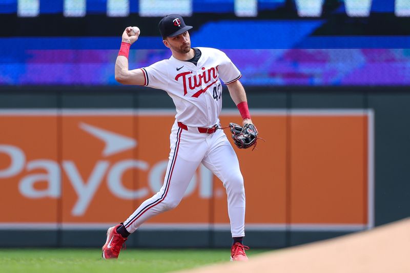 May 16, 2024; Minneapolis, Minnesota, USA; Minnesota Twins second baseman Edouard Julien (47) throws the ball to first base to get out New York Yankees Jon Berti (19) during the second inning at Target Field. Mandatory Credit: Matt Krohn-USA TODAY Sports