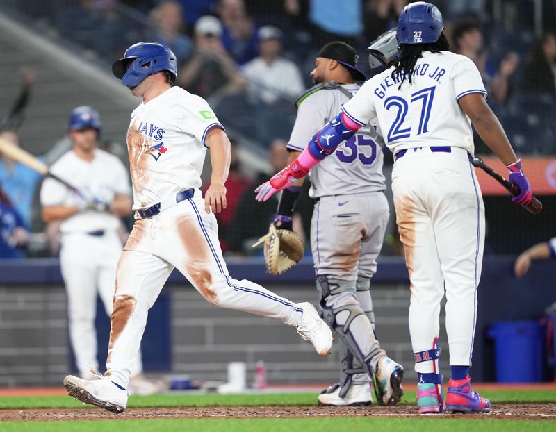 Apr 12, 2024; Toronto, Ontario, CAN; Toronto Blue Jays Davis Schneider (36) scores a run on a n error against the Colorado Rockies during the ninth inning at Rogers Centre. Mandatory Credit: Nick Turchiaro-USA TODAY Sports