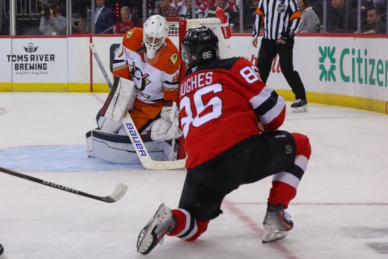 Oct 27, 2024; Newark, New Jersey, USA; Anaheim Ducks goaltender James Reimer (47) makes a save on New Jersey Devils center Jack Hughes (86) during the second period at Prudential Center. Mandatory Credit: Ed Mulholland-Imagn Images