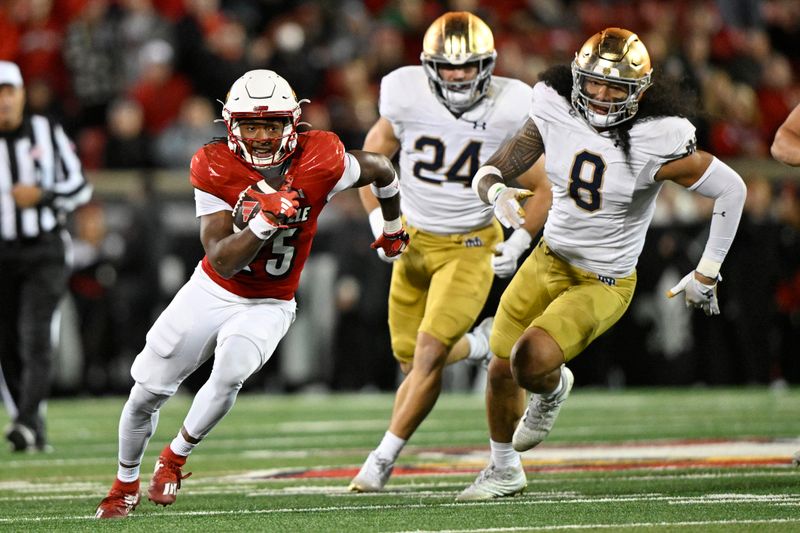 Oct 7, 2023; Louisville, Kentucky, USA; Louisville Cardinals running back Jawhar Jordan (25) runs the ball against Notre Dame Fighting Irish linebacker Marist Liufau (8) and  linebacker Jack Kiser (24) during the second half at L&N Federal Credit Union Stadium. Louisville defeated Notre Dame 33-20. Mandatory Credit: Jamie Rhodes-USA TODAY Sports