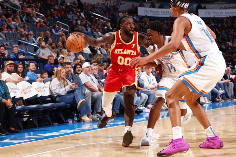 OKLAHOMA CITY, OK - OCTOBER 17: Kevon Harris #00 of the Atlanta Hawks looks to pass the ball during the game against the Oklahoma City Thunder on October 17, 2024 at Paycom Arena in Oklahoma City, Oklahoma. NOTE TO USER: User expressly acknowledges and agrees that, by downloading and or using this photograph, User is consenting to the terms and conditions of the Getty Images License Agreement. Mandatory Copyright Notice: Copyright 2024 NBAE (Photo by Zach Beeker/NBAE via Getty Images)