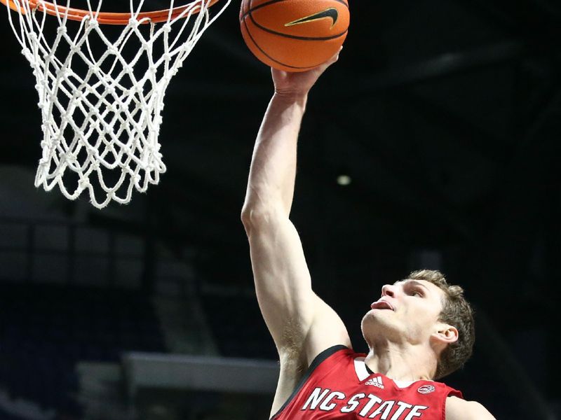 Nov 28, 2023; Oxford, Mississippi, USA; North Carolina State Wolfpack forward Ben Middlebrooks (34) dunks during the first half against the Mississippi Rebels at The Sandy and John Black Pavilion at Ole Miss. Mandatory Credit: Petre Thomas-USA TODAY Sports