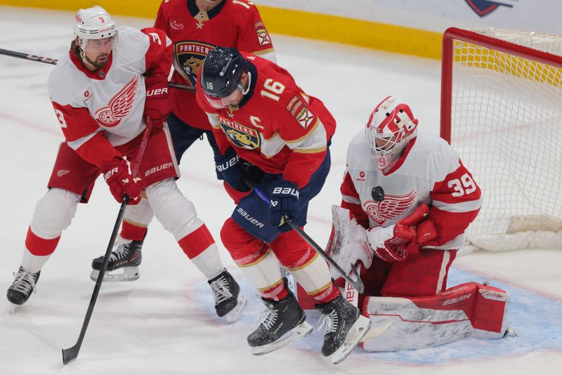 Jan 16, 2025; Sunrise, Florida, USA; Detroit Red Wings goaltender Cam Talbot (39) makes a save after a deflection from Florida Panthers center Aleksander Barkov (16) during the second period at Amerant Bank Arena. Mandatory Credit: Sam Navarro-Imagn Images