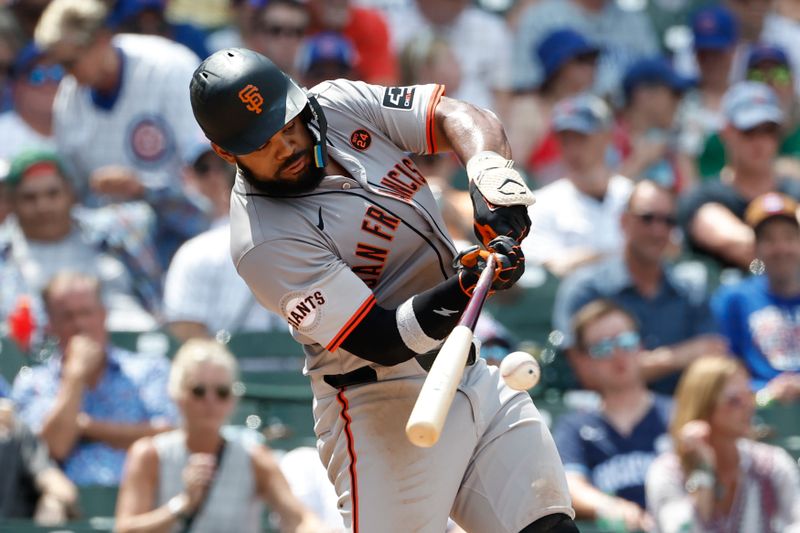 Jun 19, 2024; Chicago, Illinois, USA; San Francisco Giants outfielder Heliot Ramos (17) grounds into force out against the Chicago Cubs during the sixth inning at Wrigley Field. Mandatory Credit: Kamil Krzaczynski-USA TODAY Sports