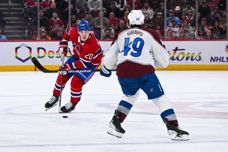 Jan 15, 2024; Montreal, Quebec, CAN; Montreal Canadiens left wing Juraj Slafkovsky (20) plays the puck against Colorado Avalanche defenseman Samuel Girard (49) during the third period at Bell Centre. Mandatory Credit: David Kirouac-USA TODAY Sports