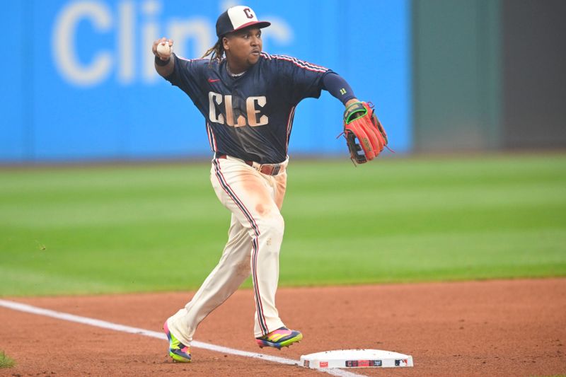 Jun 6, 2025; Cleveland, Ohio, USA; Cleveland Guardians third baseman Jose Ramirez (11) throws to first base in the third inning against the Houston Astros at Progressive Field. Mandatory Credit: David Richard-Imagn Images