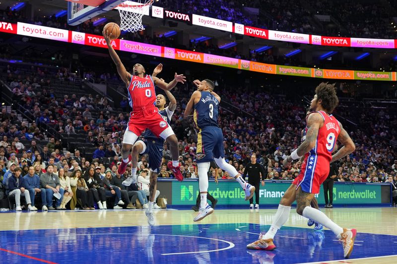 PHILADELPHIA, PENNSYLVANIA - JANUARY 10: Tyrese Maxey #0 of the Philadelphia 76ers shoots the ball against Jordan Hawkins #24 and CJ McCollum #3 of the New Orleans Pelicans in the second half at the Wells Fargo Center on January 10, 2025 in Philadelphia, Pennsylvania. The Pelicans defeated the 76ers 123-115. NOTE TO USER: User expressly acknowledges and agrees that, by downloading and/or using this photograph, user is consenting to the terms and conditions of the Getty Images License Agreement. (Photo by Mitchell Leff/Getty Images)