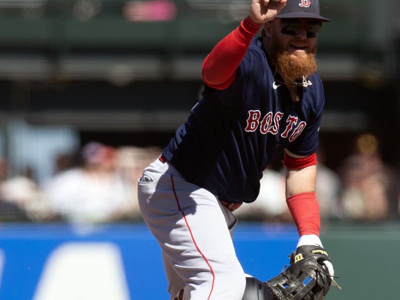 Jul 30, 2023; San Francisco, California, USA; Boston Red Sox second baseman Justin Turner (2) holds the ball after forcing out San Francisco Giants pinch hitter LaMonte Wade Jr. during the 10th inning at Oracle Park. Mandatory Credit: D. Ross Cameron-USA TODAY Sports