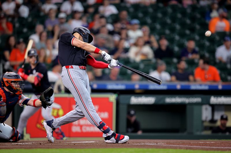 Jun 2, 2024; Houston, Texas, USA; Minnesota Twins left fielder Trevor Larnach (9) hits a home run against the Houston Astros during the first inning at Minute Maid Park. Mandatory Credit: Erik Williams-USA TODAY Sports