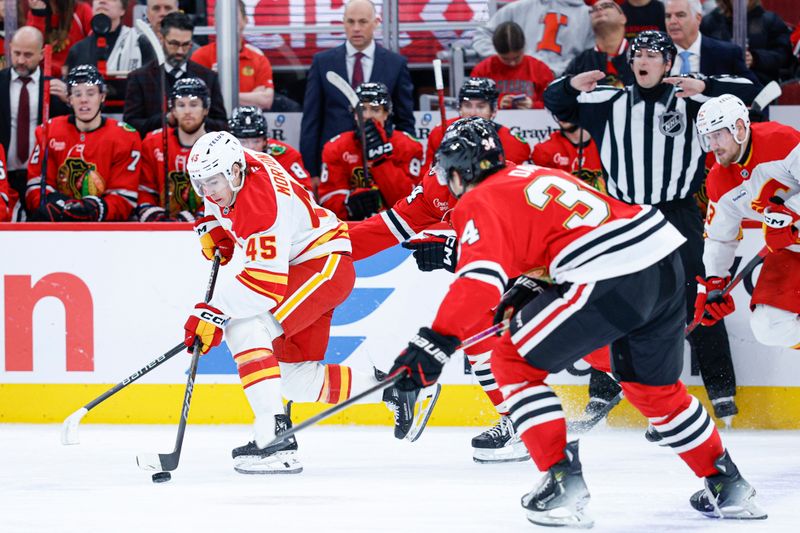 Nov 18, 2025; Chicago, Illinois, USA; Calgary Flames center Sam Morton (45) tries to control the puck against the Chicago Blackhawks during the second period at United Center. Mandatory Credit: Kamil Krzaczynski-Imagn Images