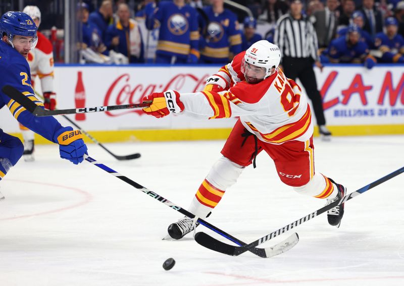 Oct 19, 2023; Buffalo, New York, USA;  Calgary Flames center Nazem Kadri (91) gets his shot blocked by Buffalo Sabres defenseman Mattias Samuelsson (23) during the third period at KeyBank Center. Mandatory Credit: Timothy T. Ludwig-USA TODAY Sports