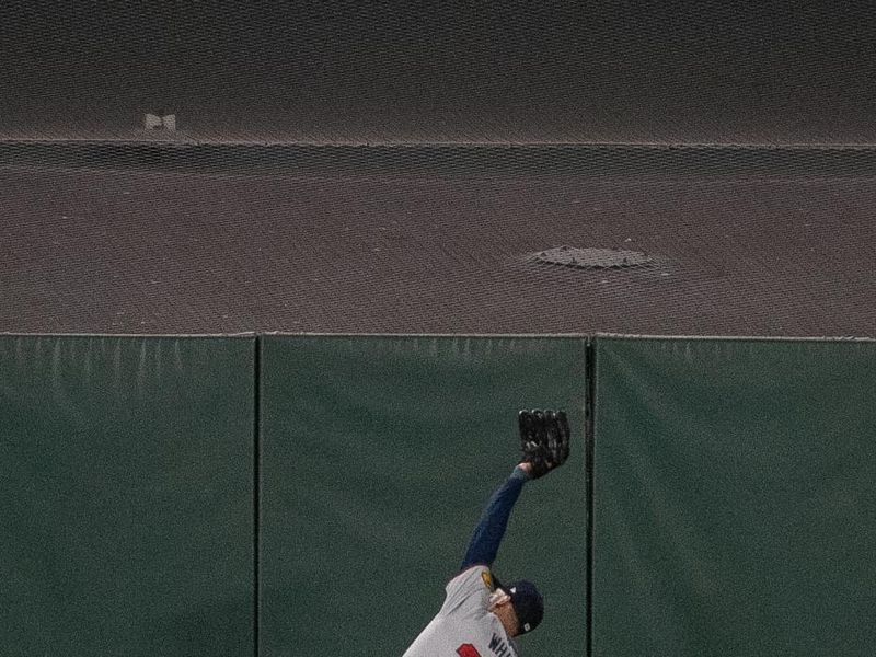 Aug 13, 2024; San Francisco, California, USA;  Atlanta Braves outfielder Eli White (36) makes a catch against the San Francisco Giants during the ninth inning at Oracle Park. Mandatory Credit: Ed Szczepanski-USA TODAY Sports