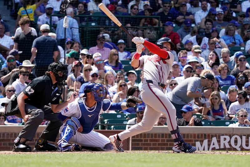 May 23, 2024; Chicago, Illinois, USA; Atlanta Braves outfielder Jarred Kelenic (24) hits a home run against the Chicago Cubs during the fifth inning at Wrigley Field. Mandatory Credit: David Banks-USA TODAY Sports