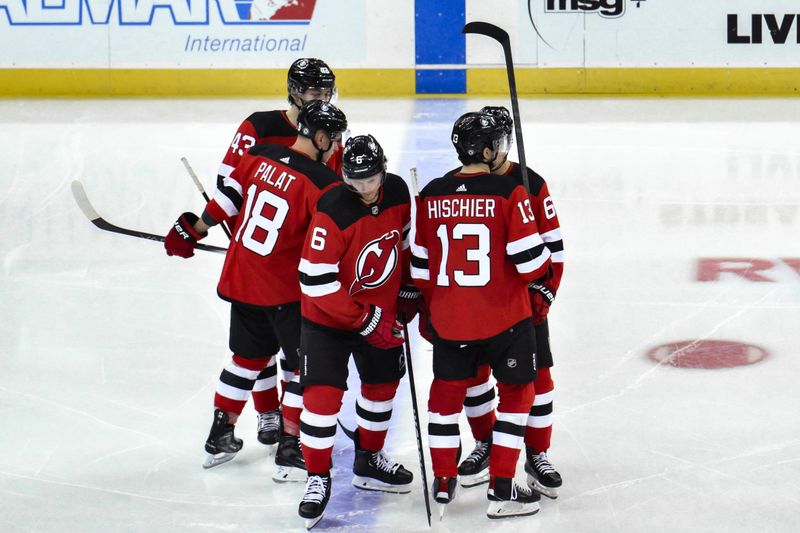 Feb 8, 2024; Newark, New Jersey, USA; New Jersey devils players huddle before the start of the third period against the Calgary Flames at Prudential Center. Mandatory Credit: John Jones-USA TODAY Sports