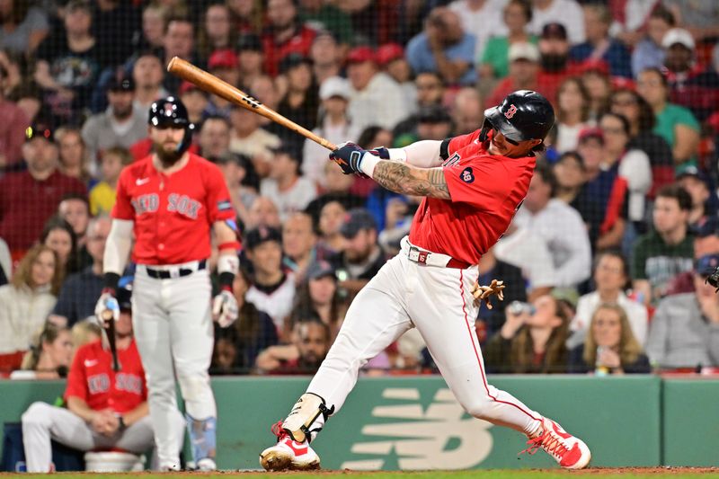 Sep 27, 2024; Boston, Massachusetts, USA; Boston Red Sox left fielder Jarren Duran (16) hits a single against the Tampa Bay Rays during third inning at Fenway Park. Mandatory Credit: Eric Canha-Imagn Images