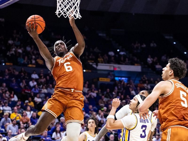 Feb 1, 2025; Baton Rouge, Louisiana, USA;  LSU Tigers forward Robert Miller III (6) drives to the basket against LSU Tigers guard Curtis Givens III (3) during the second half at Pete Maravich Assembly Center. Mandatory Credit: Stephen Lew-Imagn Images