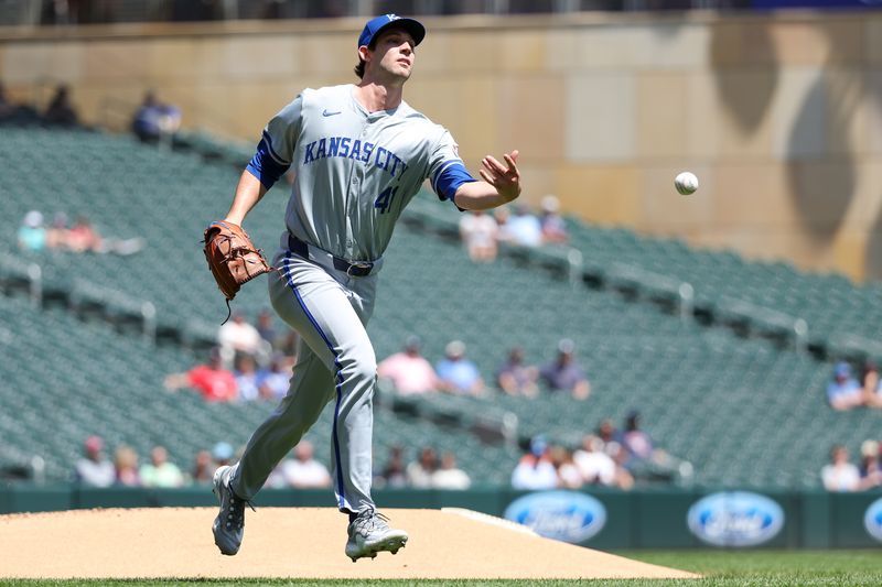 May 30, 2024; Minneapolis, Minnesota, USA; Kansas City Royals starting pitcher Daniel Lynch IV (41) flips the ball to first base to get out Minnesota Twins designated hitter Ryan Jeffers (27) during the first inning at Target Field. Mandatory Credit: Matt Krohn-USA TODAY Sports