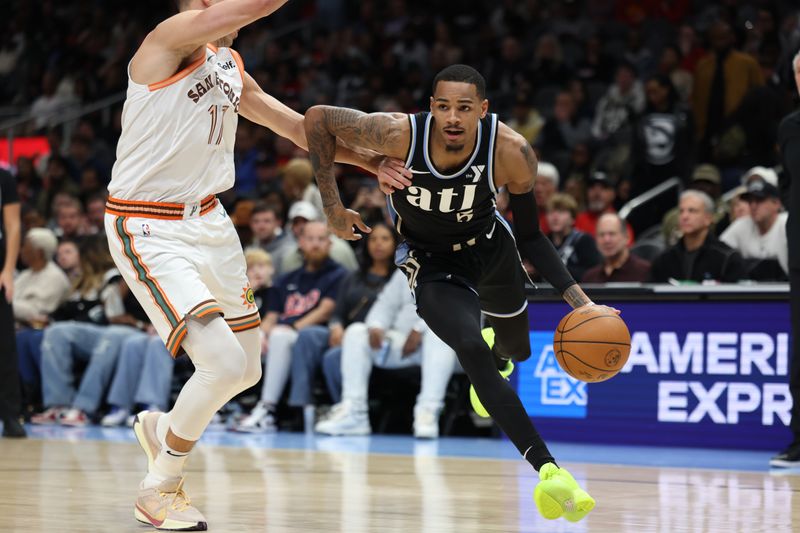 ATLANTA, GA - JANUARY 15: Dejounte Murray #5 of the Atlanta Hawks handles the ball during the game against the San Antonio Spurs on January 15, 2024 at State Farm Arena in Atlanta, Georgia.  NOTE TO USER: User expressly acknowledges and agrees that, by downloading and/or using this Photograph, user is consenting to the terms and conditions of the Getty Images License Agreement. Mandatory Copyright Notice: Copyright 2024 NBAE (Photo by Mercedes Oliver/NBAE via Getty Images)