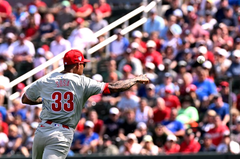 Mar 3, 2024; North Port, Florida, USA; Philadelphia Phillies third baseman Edmundo Sosa (33) throws to first base in the second inning of the spring training game against the Atlanta Braves at CoolToday Park. Mandatory Credit: Jonathan Dyer-USA TODAY Sports