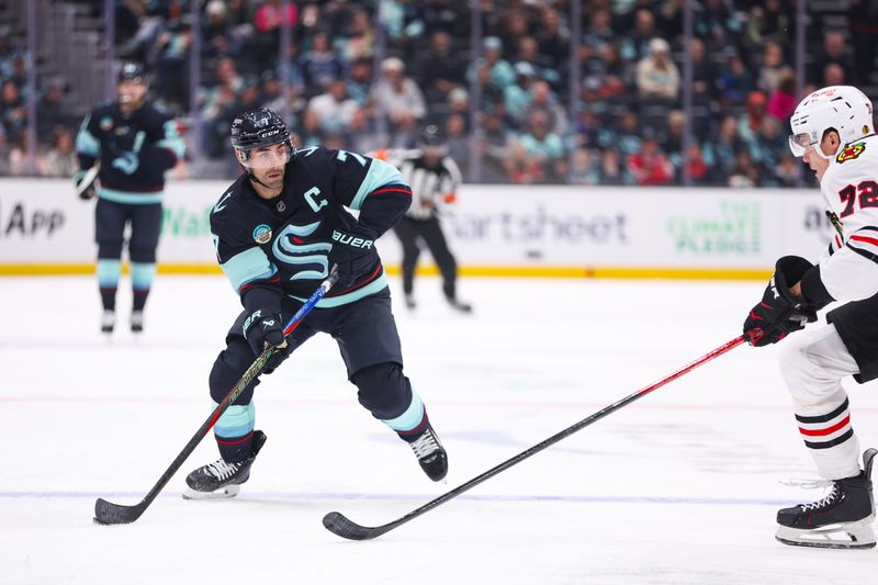 Nov 3, 2025; Seattle, Washington, USA; Seattle Kraken right wing Jordan Eberle (7) controls the puck in the second period against the Chicago Blackhawks at Climate Pledge Arena. Mandatory Credit: Kevin Ng-Imagn Images