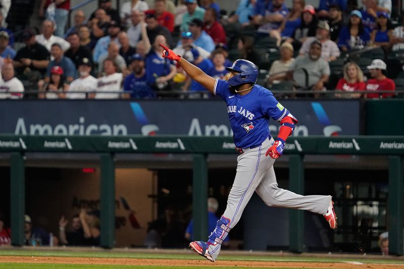 Sep 19, 2024; Arlington, Texas, USA; Toronto Blue Jays first baseman Vladimir Guerrero Jr. (27) reacts after hitting a solo home run during the ninth inning against the Texas Rangers at Globe Life Field. Mandatory Credit: Raymond Carlin III-Imagn Images