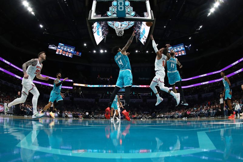 CHARLOTTE, NORTH CAROLINA - JANUARY 29: Jalen Brunson #11 of the New York Knicks attempts a lay up against Nick Richards #4 of the Charlotte Hornets during the second half of the game at Spectrum Center on January 29, 2024 in Charlotte, North Carolina. NOTE TO USER: User expressly acknowledges and agrees that, by downloading and or using this photograph, User is consenting to the terms and conditions of the Getty Images License Agreement. (Photo by Jared C. Tilton/Getty Images)