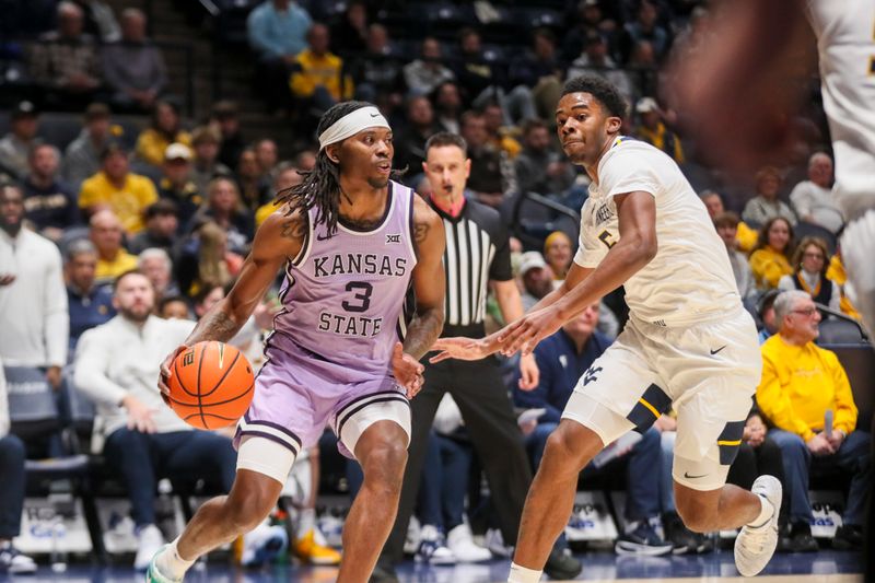 Jan 27, 2026; Morgantown, West Virginia, USA; Kansas State Wildcats guard CJ Jones (3) drives baseline against West Virginia Mountaineers forward DJ Thomas (5) during the first half at Hope Coliseum. Mandatory Credit: Ben Queen-Imagn Imagesa