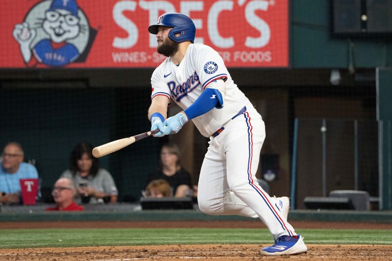 Sep 10, 2025; Arlington, Texas, USA; Texas Rangers first baseman Jake Burger (21) watches his two-run home run against the Milwaukee Brewers during the fifth inning at Globe Life Field. Mandatory Credit: Jim Cowsert-Imagn Images