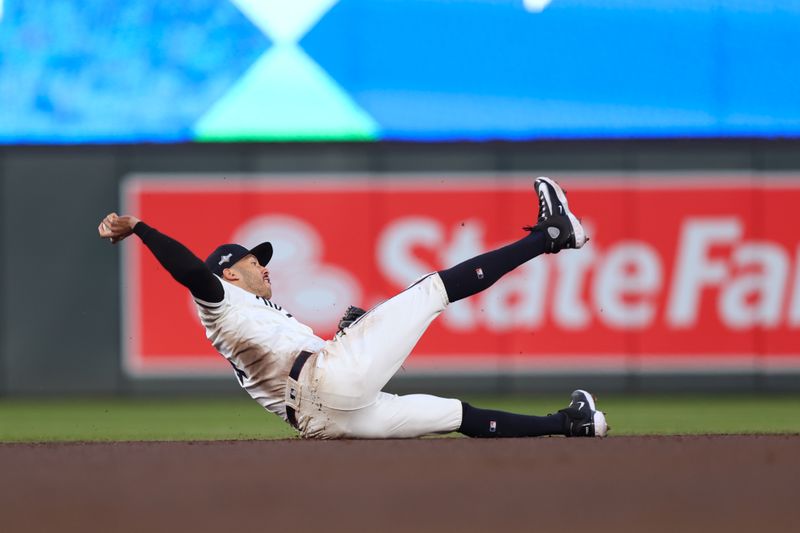 Oct 11, 2023; Minneapolis, Minnesota, USA; Minnesota Twins shortstop Carlos Correa (4) throws to first base in the second inning  during game four of the ALDS for the 2023 MLB playoffs at Target Field. Mandatory Credit: Jesse Johnson-USA TODAY Sports