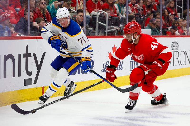 Mar 16, 2024; Detroit, Michigan, USA;  Detroit Red Wings defenseman Shayne Gostisbehere (41) skates with the puck chased by Buffalo Sabres left wing Victor Olofsson (71) in the first period at Little Caesars Arena. Mandatory Credit: Rick Osentoski-USA TODAY Sports