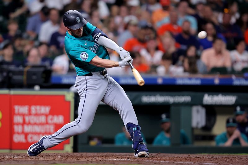 May 4, 2024; Houston, Texas, USA; Seattle Mariners designated hitter Mitch Garver (18) hits an RBI double against the Houston Astros during the fourth inning at Minute Maid Park. Mandatory Credit: Erik Williams-USA TODAY Sports