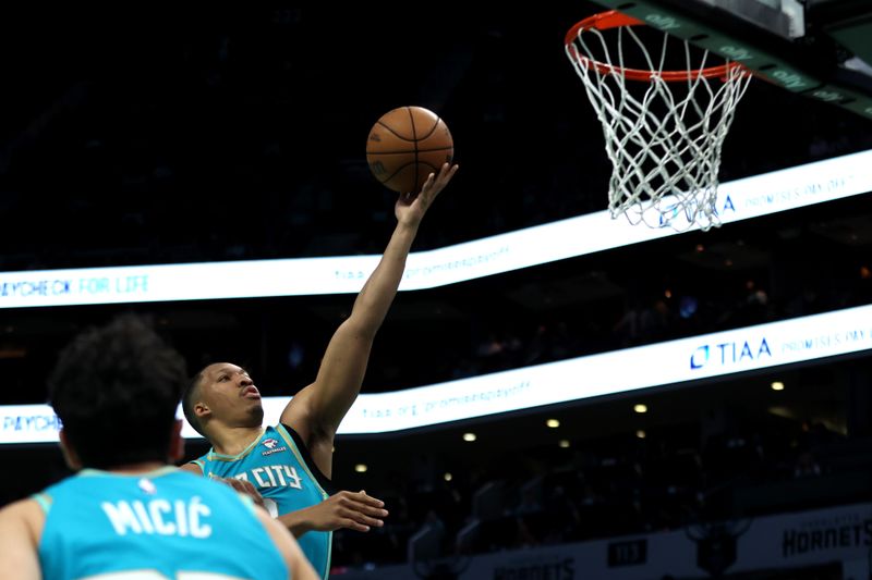 CHARLOTTE, NORTH CAROLINA - APRIL 09: Grant Williams #2 of the Charlotte Hornets lays the ball up during the first half of an NBA game against the Dallas Mavericks at Spectrum Center on April 09, 2024 in Charlotte, North Carolina. NOTE TO USER: User expressly acknowledges and agrees that, by downloading and or using this photograph, User is consenting to the terms and conditions of the Getty Images License Agreement. (Photo by David Jensen/Getty Images)