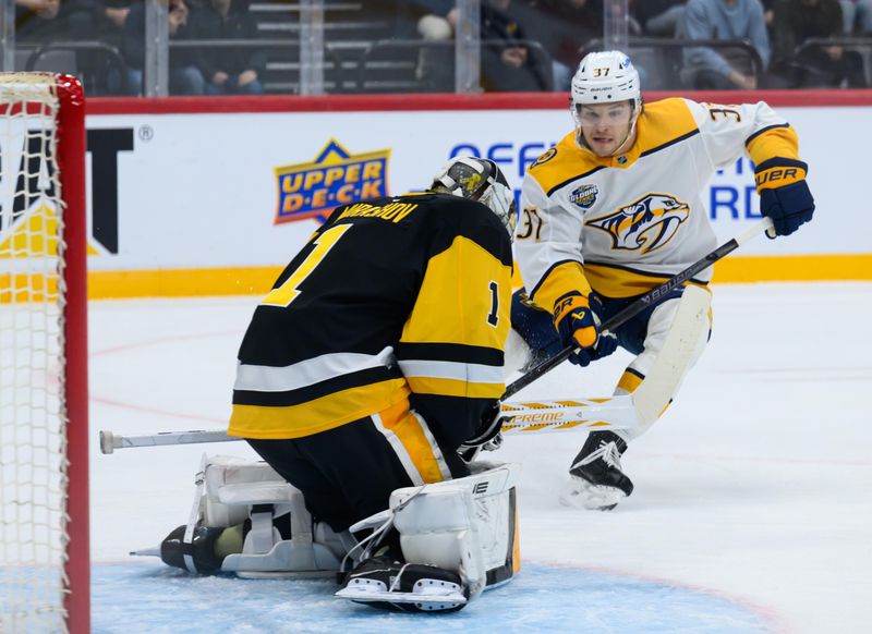 Nov 16, 2025; Stockholm, SWEDEN;  Pittsburgh Penguins goaltender Sergei Murashov (1) makes a save against Nashville Predators defenseman Nick Blankenburg (37) in a Global Series ice hockey game at Avicii Arena. Mandatory Credit: Per Haljestam-Imagn Images