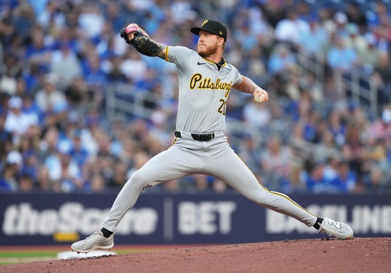 May 31, 2024; Toronto, Ontario, CAN; Pittsburgh Pirates starting pitcher Bailey Falter (26) throws a pitch against the Toronto Blue Jays during the first inning at Rogers Centre. Mandatory Credit: Nick Turchiaro-USA TODAY Sports