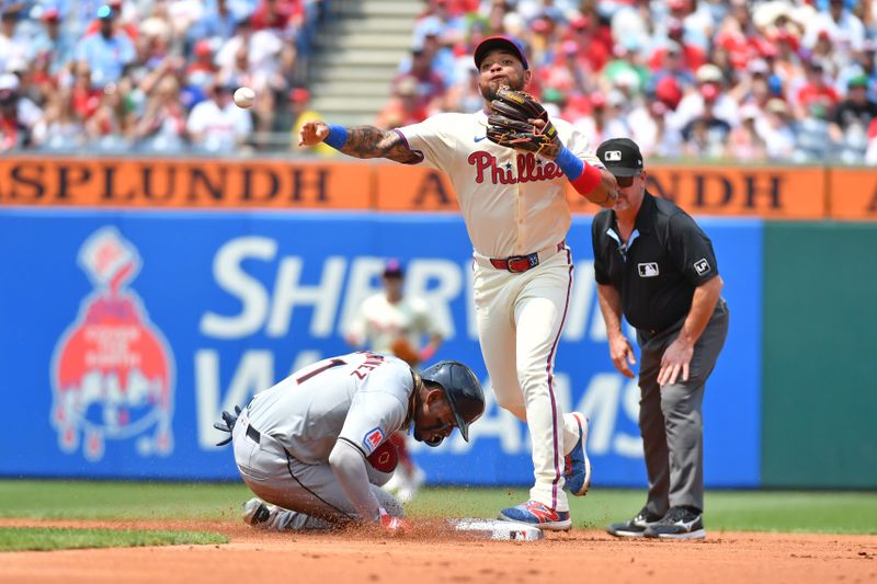 Jul 28, 2024; Philadelphia, Pennsylvania, USA; Philadelphia Phillies shortstop Edmundo Sosa (33) gets force out on Cleveland Guardians third base Angel Martínez (1) and throws to first base to complete double play during the first inning at Citizens Bank Park. Mandatory Credit: Eric Hartline-USA TODAY Sports