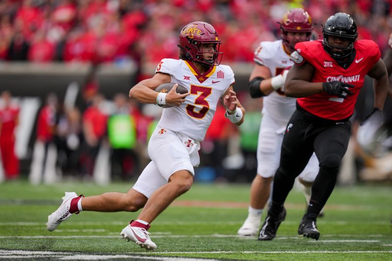 Oct 14, 2023; Cincinnati, Ohio, USA;  Iowa State Cyclones quarterback Rocco Becht (3) runs with the ball against the Cincinnati Bearcats in the first half at Nippert Stadium. Mandatory Credit: Aaron Doster-USA TODAY Sports