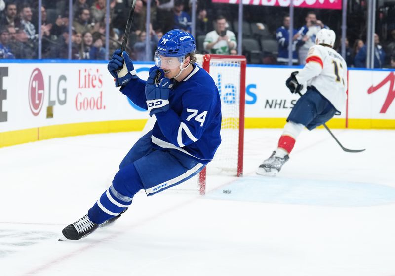 Jan 6, 2026; Toronto, Ontario, CAN; Toronto Maple Leafs center Bobby McMann (74) scores an empty net goal against the Florida Panthers during the third period at Scotiabank Arena. Mandatory Credit: Nick Turchiaro-Imagn Images