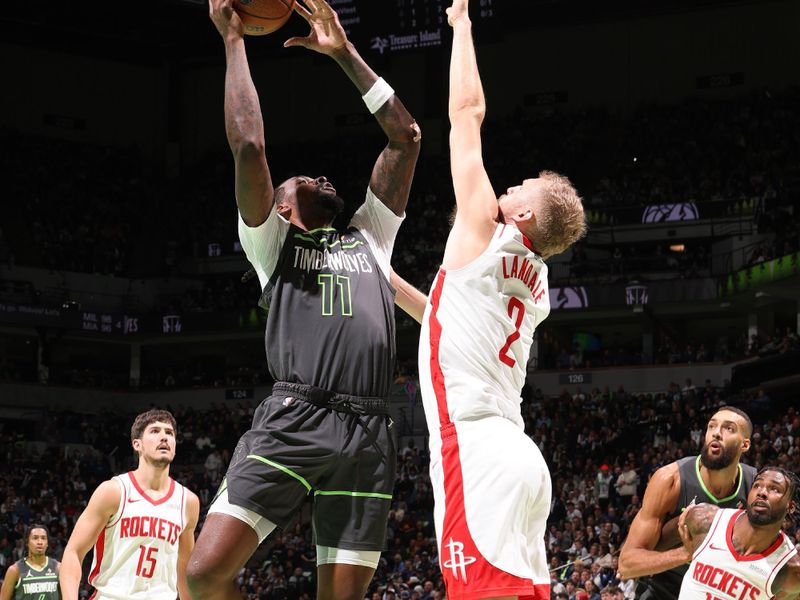 MINNEAPOLIS, MN -  NOVEMBER 26: Naz Reid #11 of the Minnesota Timberwolves drives to the basket during the game against the Houston Rockets during the Emirates NBA Cup game on November 26, 2024 at Target Center in Minneapolis, Minnesota. NOTE TO USER: User expressly acknowledges and agrees that, by downloading and or using this Photograph, user is consenting to the terms and conditions of the Getty Images License Agreement. Mandatory Copyright Notice: Copyright 2024 NBAE (Photo by David Sherman/NBAE via Getty Images)