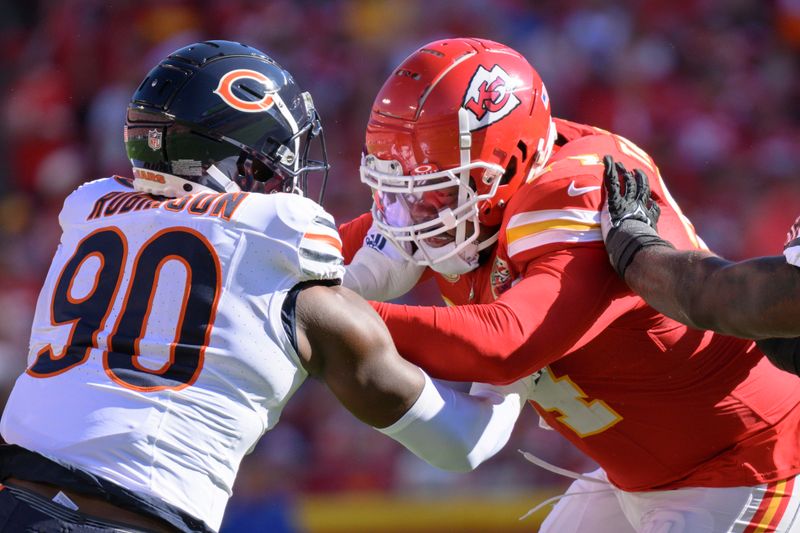 Kansas City Chiefs offensive tackle Jawaan Taylor, right, blocks Chicago Bears defensive end Dominique Robinson (90) during the first half of an NFL football game, Sunday, Sept. 24, 2023 in Kansas City, Mo. (AP Photo/Reed Hoffmann)