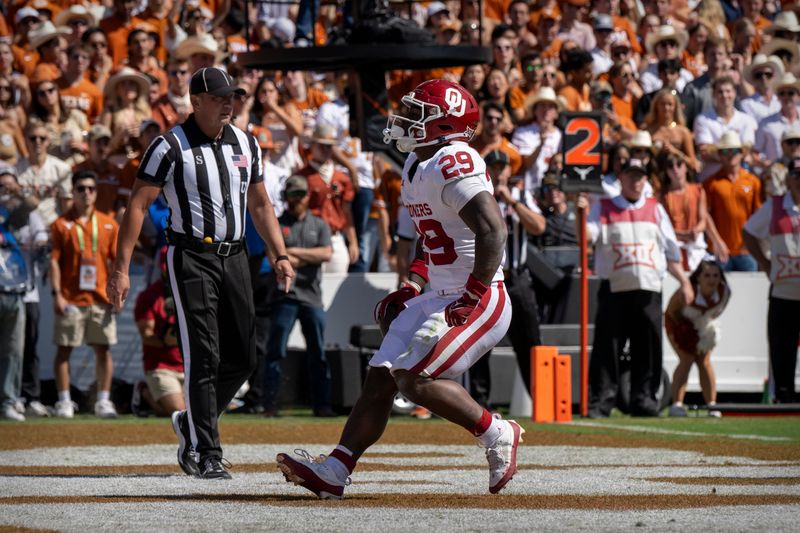 Oct 7, 2023; Dallas, Texas, USA; Oklahoma Sooners running back Tawee Walker (29) scores a rushing touchdown against the Texas Longhorns during the first half at the Cotton Bowl. Mandatory Credit: Jerome Miron-USA TODAY Sports