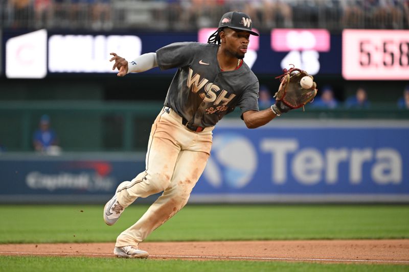 Aug 31, 2024; Washington, District of Columbia, USA; Washington Nationals third baseman Jose Tena (8) fields a ground ball against the Chicago Cubs during the seventh inning at Nationals Park. Mandatory Credit: Rafael Suanes-USA TODAY Sports