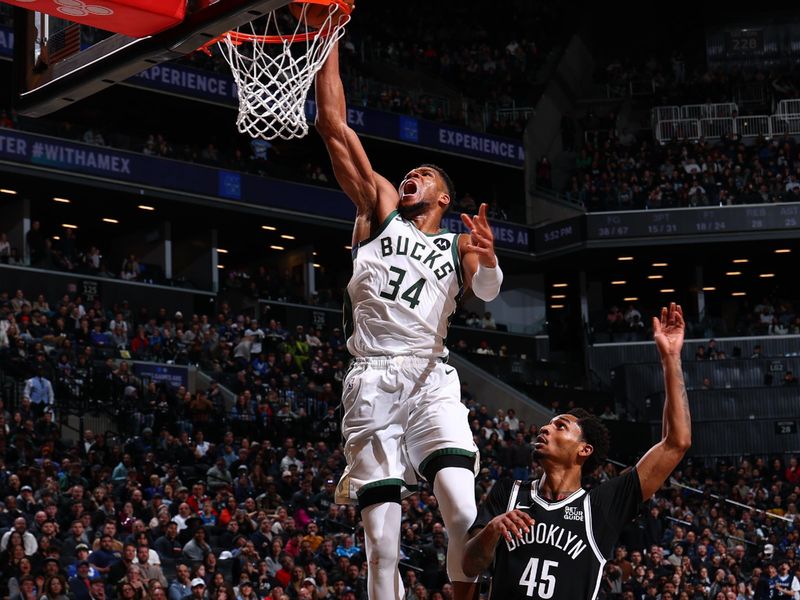 BROOKLYN, NY - DECEMBER 8: Giannis Antetokounmpo #34 of the Milwaukee Bucks dunks the ball during the game  against the Brooklyn Nets on December 8, 2024 at Barclays Center in Brooklyn, New York. NOTE TO USER: User expressly acknowledges and agrees that, by downloading and or using this Photograph, user is consenting to the terms and conditions of the Getty Images License Agreement. Mandatory Copyright Notice: Copyright 2024 NBAE (David L. Nemec/NBAE via Getty Images)