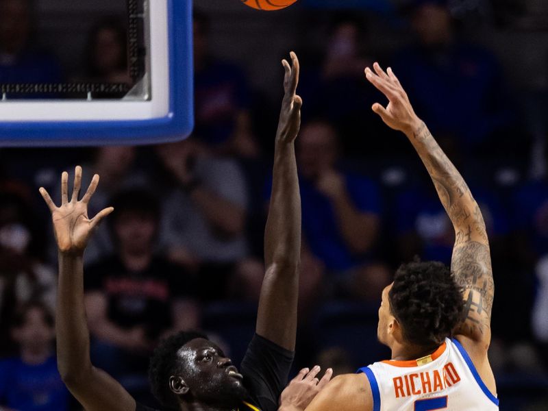 Feb 28, 2024; Gainesville, Florida, USA; Florida Gators guard Will Richard (5) shoots over Missouri Tigers center Mabor Majak (45) during the first half at Exactech Arena at the Stephen C. O'Connell Center. Mandatory Credit: Matt Pendleton-USA TODAY Sports